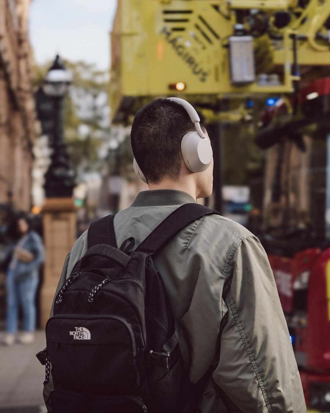 Male camera operator wearing headphones on a broadcast set