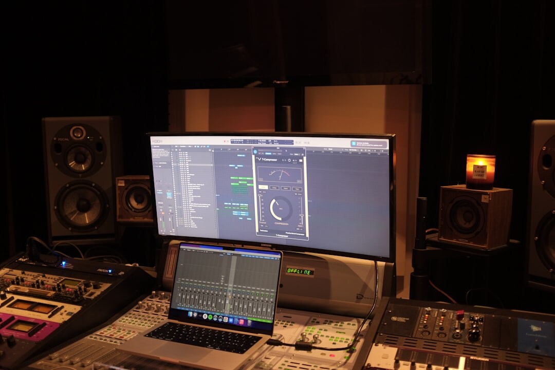 Broadcast control room with multiple video monitors and mixing desks