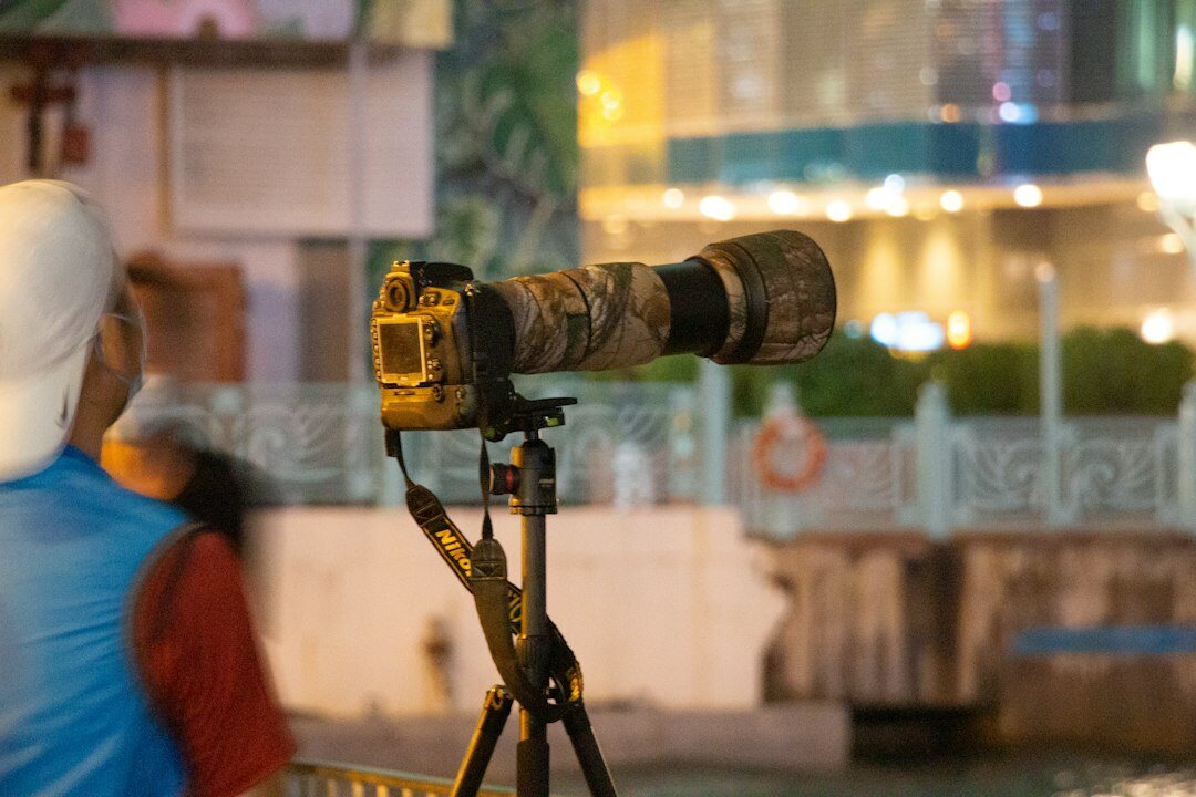 Camera operator filming a live news broadcast
